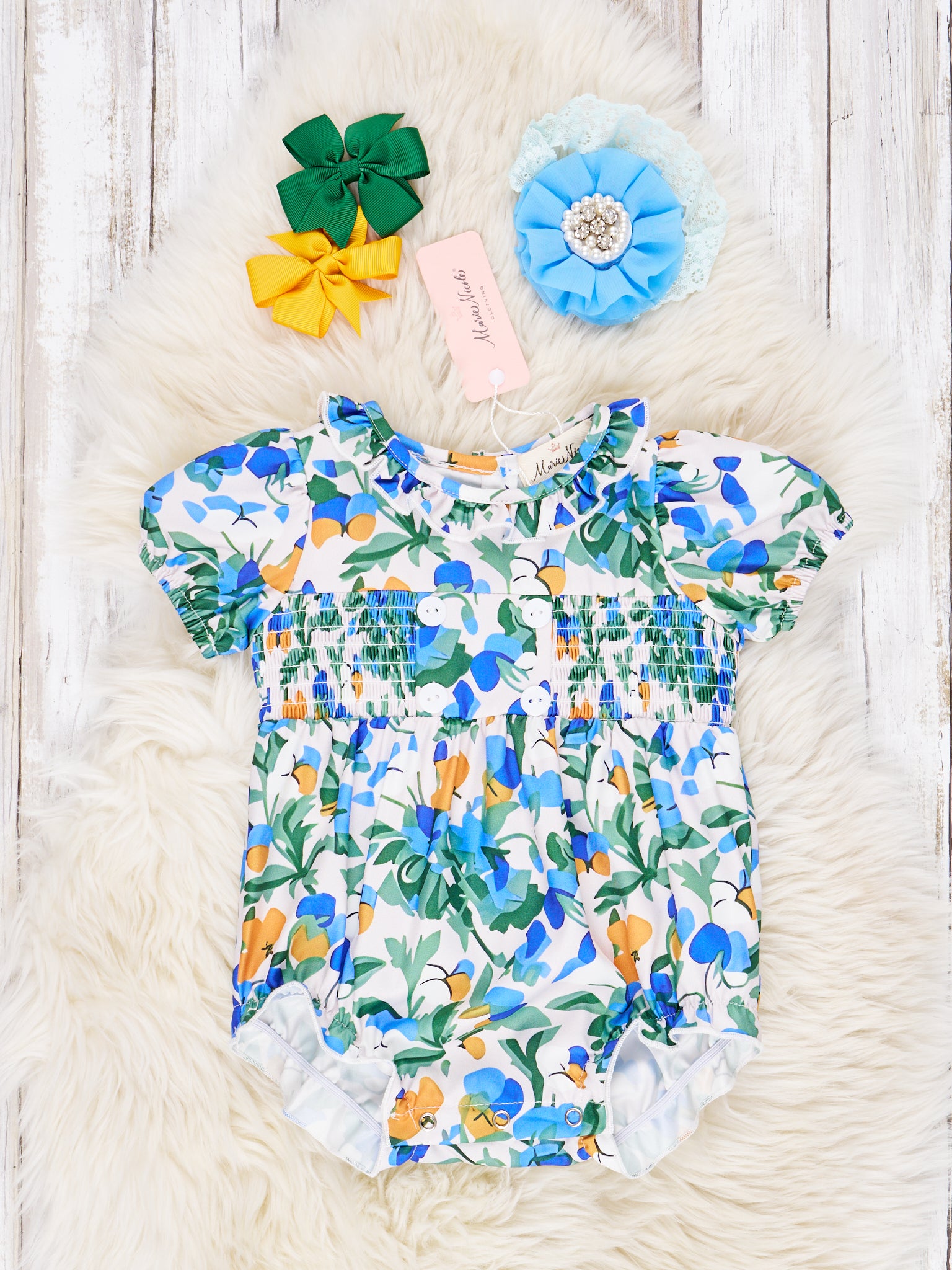 Smocked Royal Blue Floral Ruffle Romper - Marie Nicole Clothing