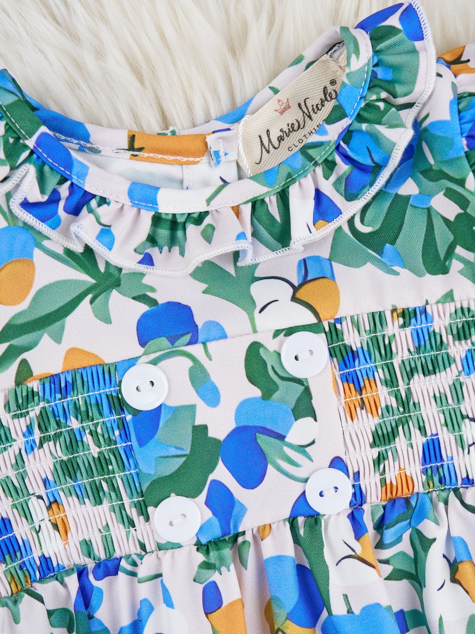 Smocked Royal Blue Floral Ruffle Romper - Marie Nicole Clothing