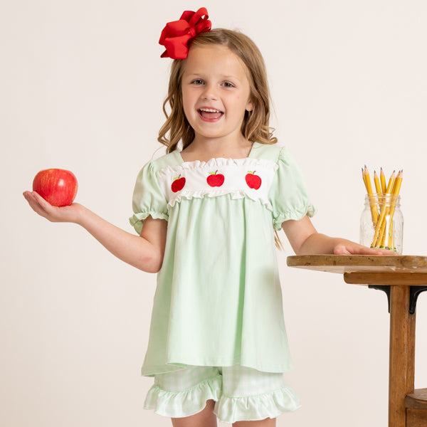 young girl wears apple back to school outfit