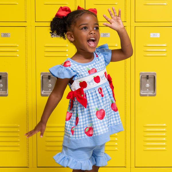 young girl wears apple back to school outfit