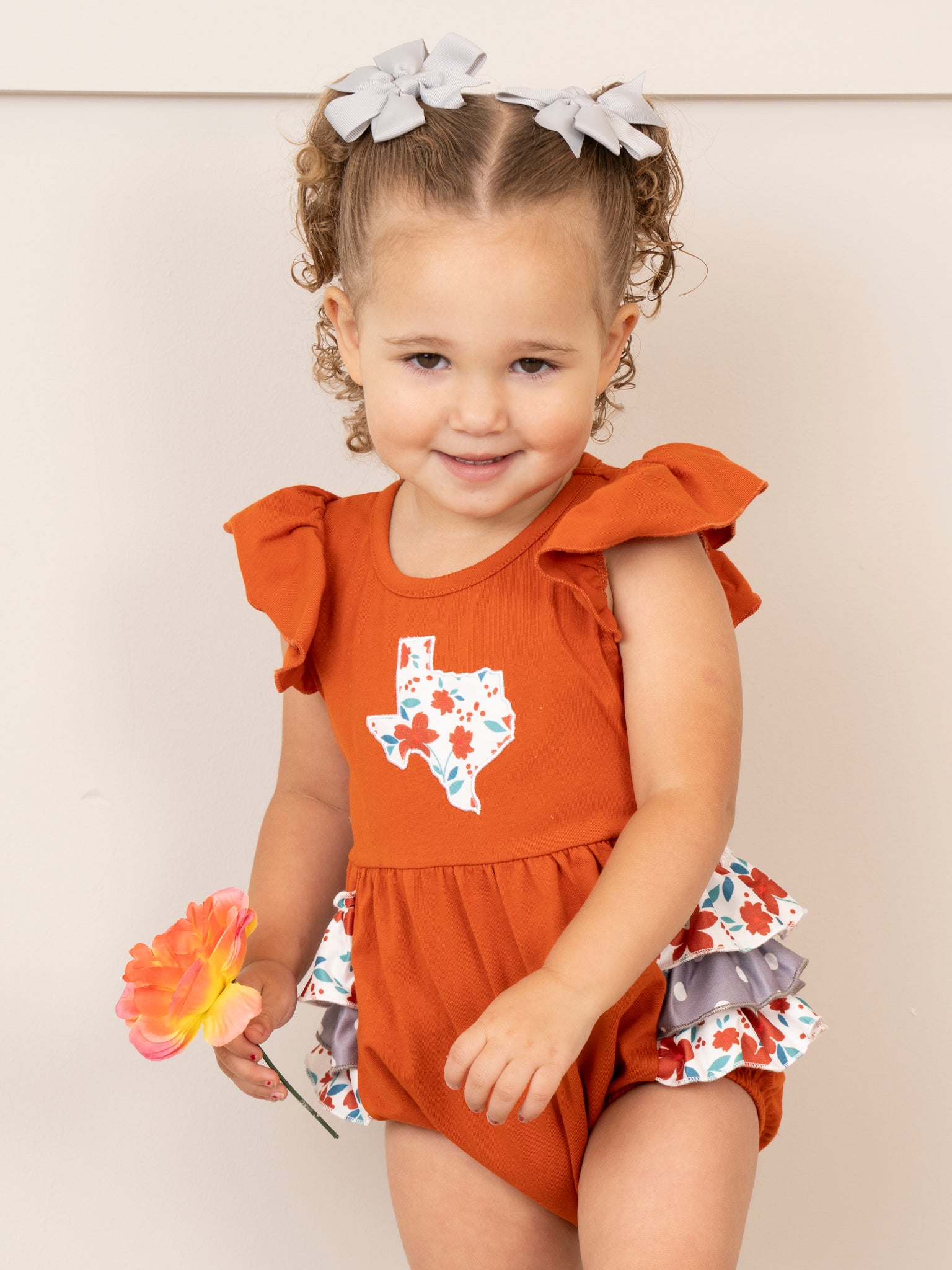 TX Burnt Orange Floral Ruffle Bubble Romper - Marie Nicole Clothing