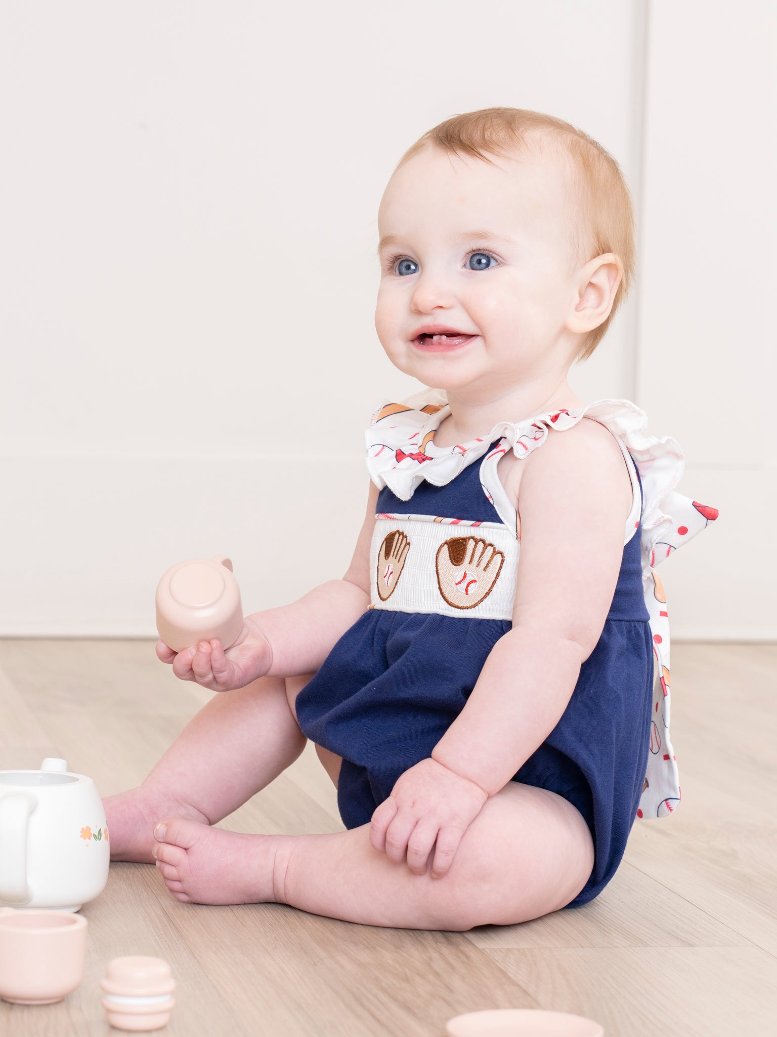 Navy & White Smocked Baseball Ruffle Bubble Romper - Marie Nicole Clothing