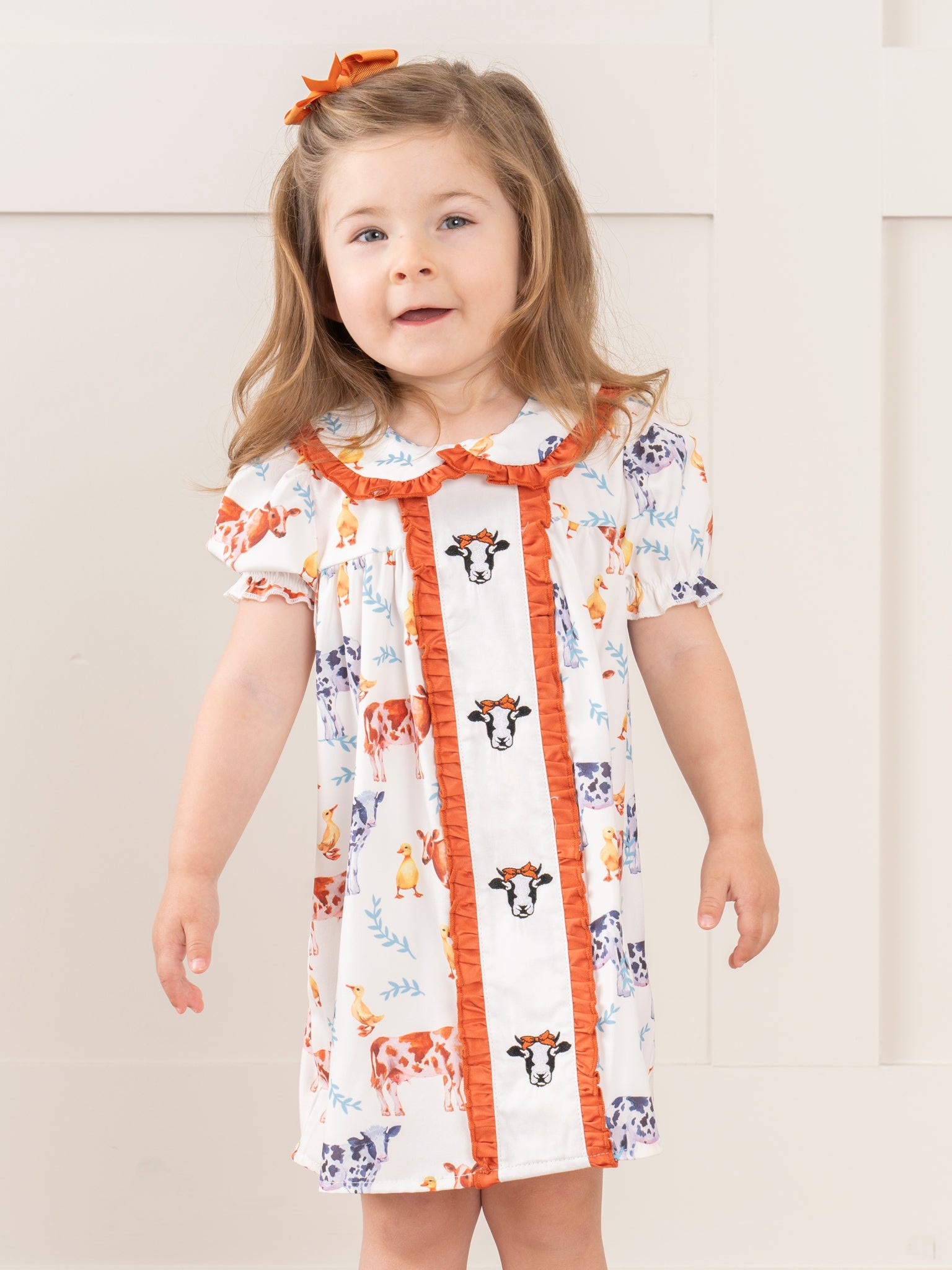 Cream & Bronze Embroidered Cow Ruffle Dress - Marie Nicole Clothing