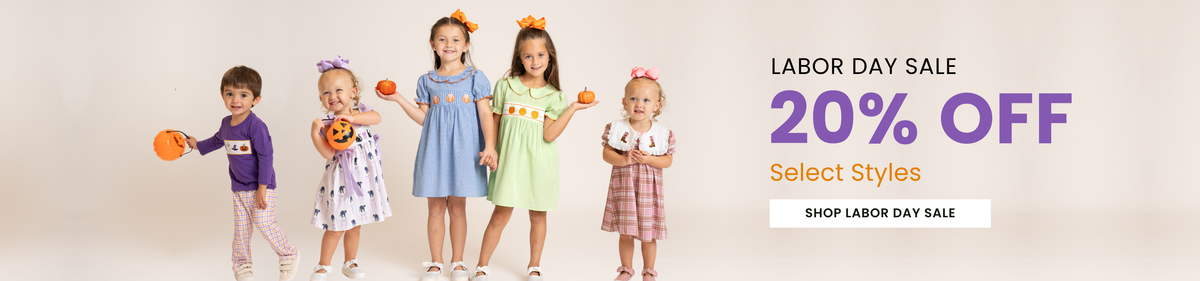 A promotional banner for a Labor Day sale showing four young children modeling colorful dresses and outfits against a light beige background, with text on the right reading 'LABOR DAY SALE 20% OFF Select Styles SHOP LABOR DAY SALE'.