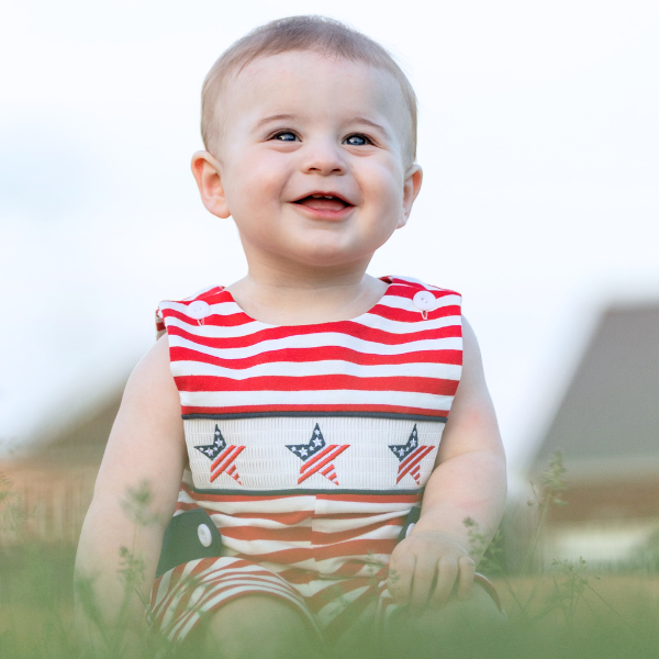 toddler boy wears red striped romper