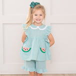 young girl wearing watermelon outfit