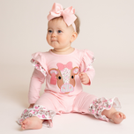 baby wearing cow romper