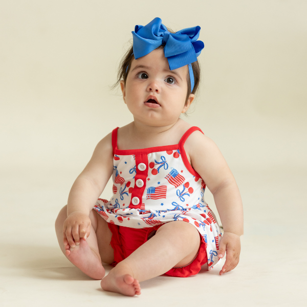 baby wearing patriotic USA bubble romper