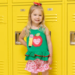 young girl wears apple back to school outfit