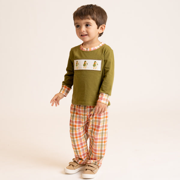 young boy wearing fall outfit