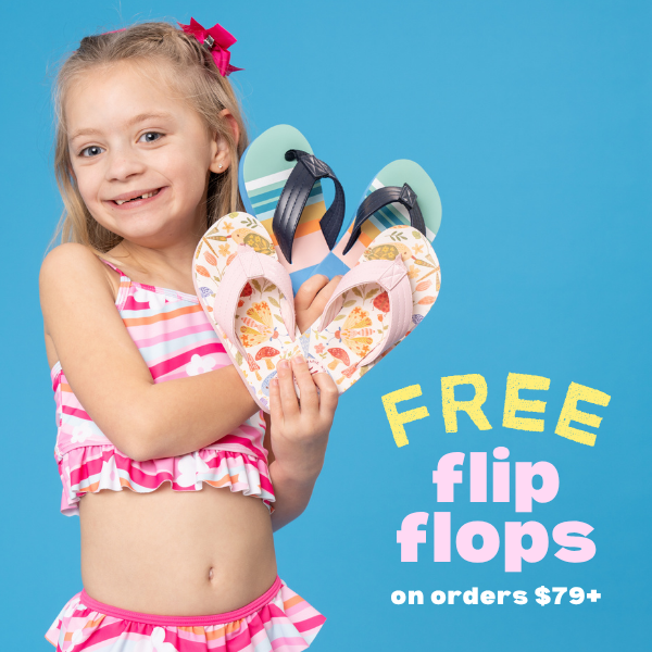 young girl holds flip flops - free flip flops on orders of $79 or more
