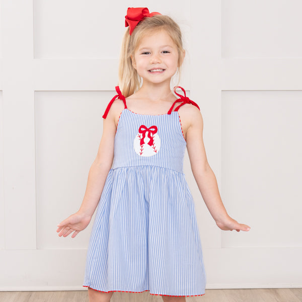young girl wears baseball dress