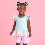 young girl wears sailboat outfit