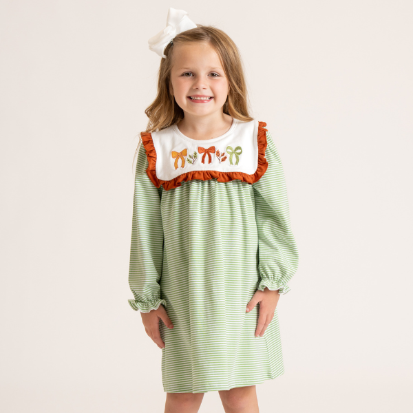 young girl wearing fall dress