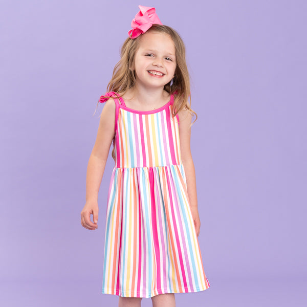 young girl wears striped summer dress