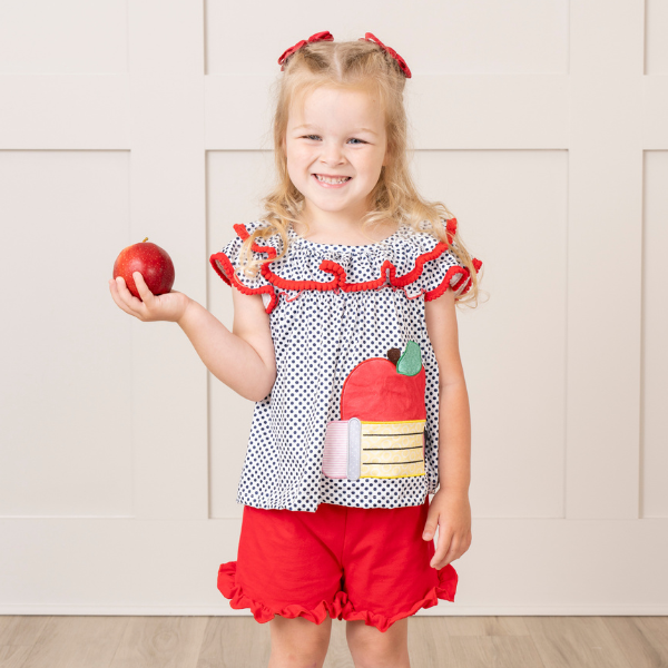 young girl wears back to school outfit