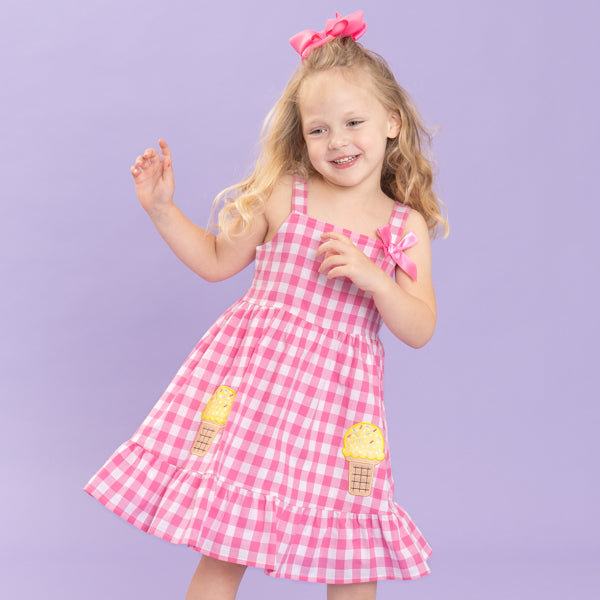 young girl wearing ice cream gingham dress