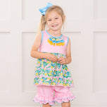 young girl wears floral outfit