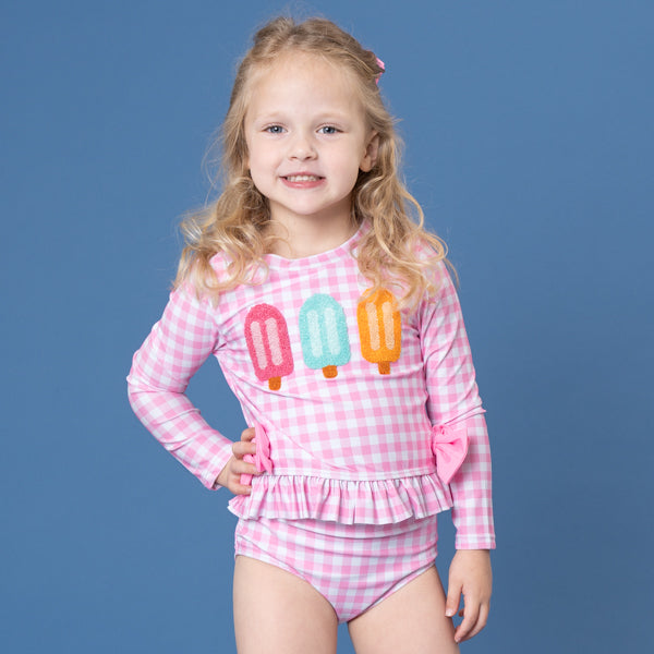 young girl wears popsicle swimsuit
