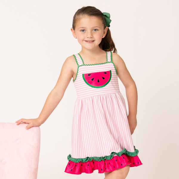 young girl wears watermelon dress